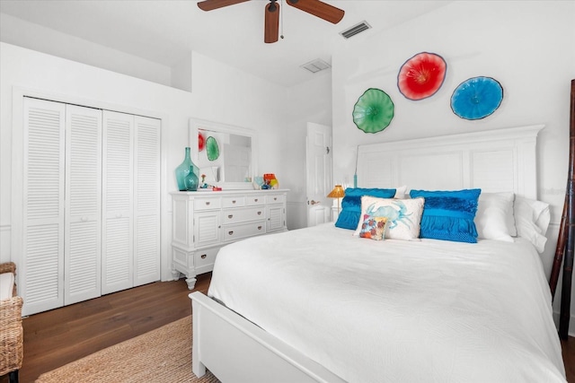 bedroom with visible vents, a closet, wood finished floors, and a ceiling fan