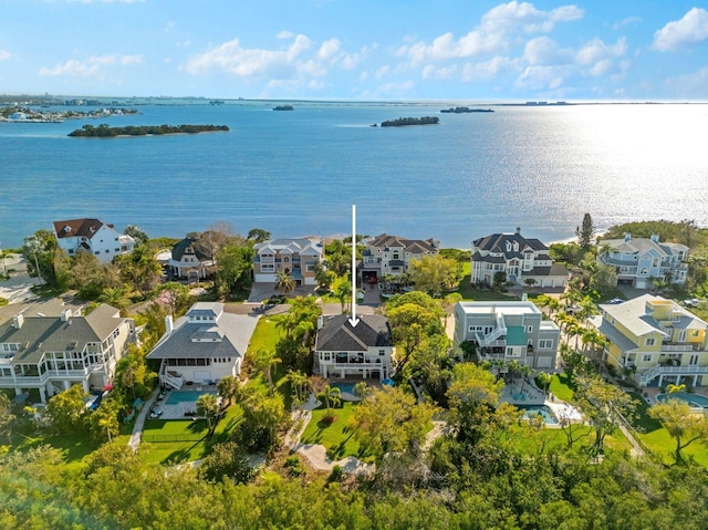 drone / aerial view featuring a residential view and a water view