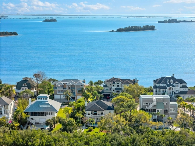 drone / aerial view featuring a residential view and a water view