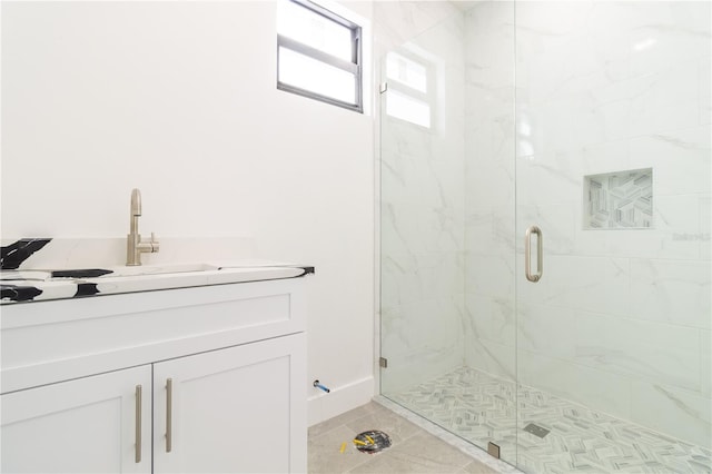 bathroom with vanity, tile patterned flooring, and an enclosed shower