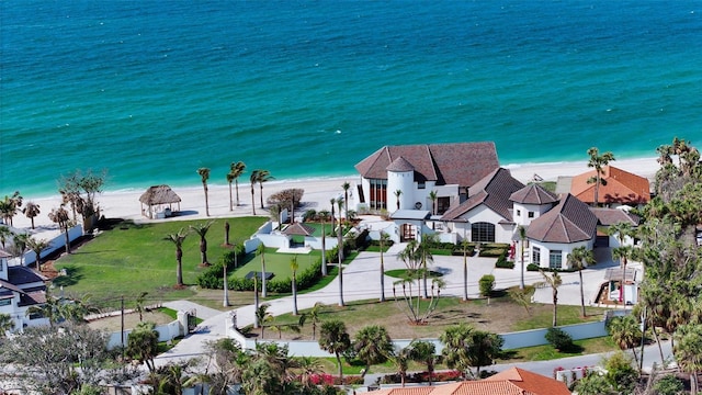 bird's eye view featuring a view of the beach and a water view