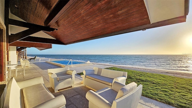 view of patio / terrace featuring a water view and outdoor lounge area