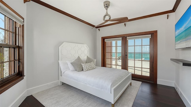 bedroom featuring dark wood-style floors, baseboards, and crown molding