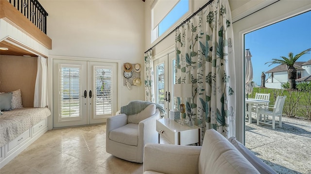 sunroom / solarium featuring french doors