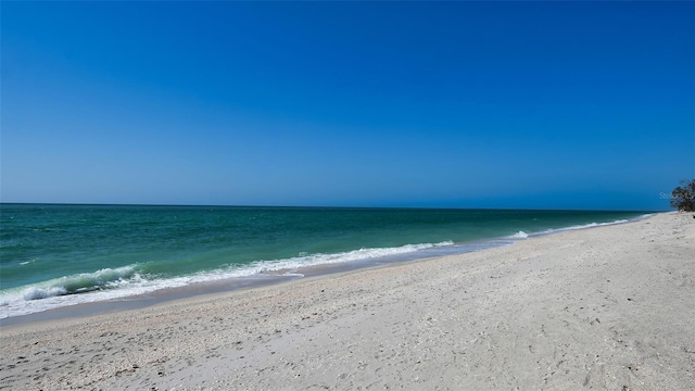 view of water feature with a beach view