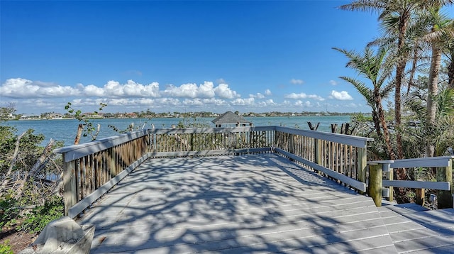 wooden deck with a water view