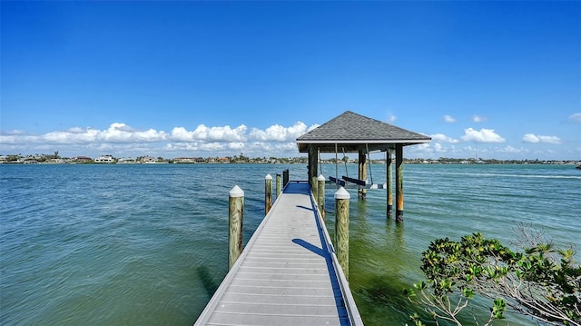 dock area featuring a water view and boat lift