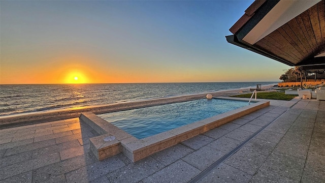 view of pool featuring a water view