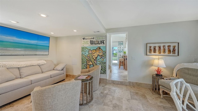 living room featuring visible vents, recessed lighting, stone tile flooring, and baseboards