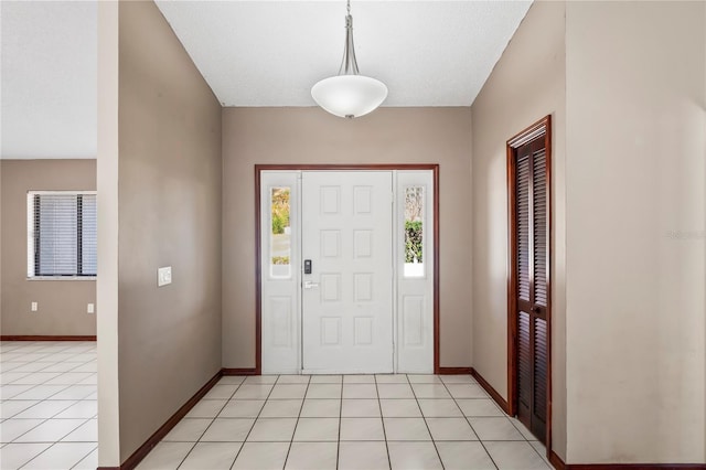 13112 Groveland St, Spring Hill, FL 34609 - entryway with baseboards and light tile patterned floors