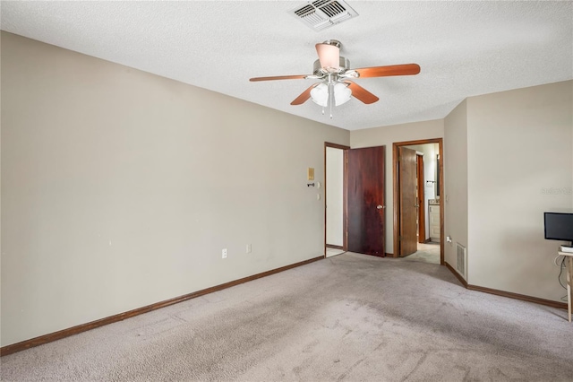 13112 Groveland St, Spring Hill, FL 34609 - unfurnished bedroom with light carpet, a textured ceiling, visible vents, and baseboards