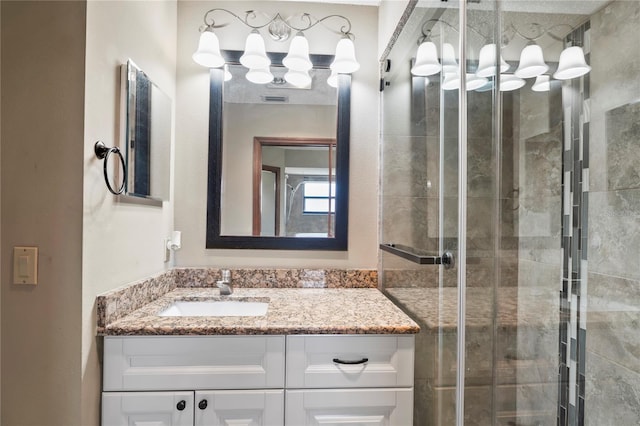 13112 Groveland St, Spring Hill, FL 34609 - bathroom featuring a stall shower, visible vents, and vanity