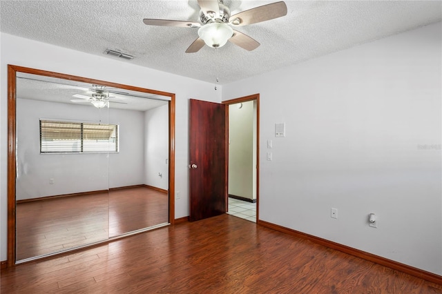 13112 Groveland St, Spring Hill, FL 34609 - unfurnished room with baseboards, visible vents, a ceiling fan, wood finished floors, and a textured ceiling