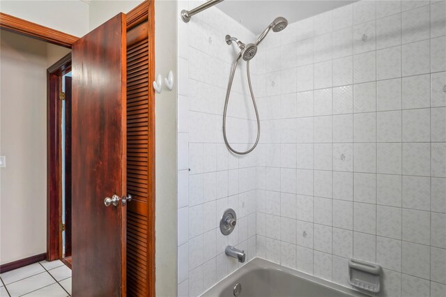 13112 Groveland St, Spring Hill, FL 34609 - bathroom with baseboards, bathing tub / shower combination, and tile patterned floors