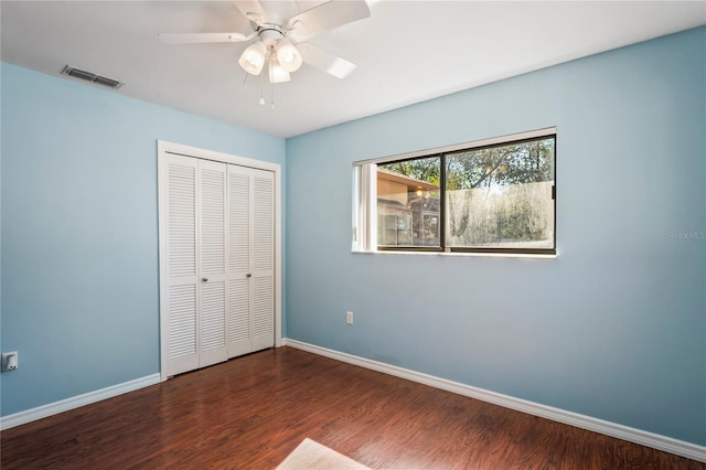13112 Groveland St, Spring Hill, FL 34609 - unfurnished bedroom featuring a closet, visible vents, baseboards, and wood finished floors