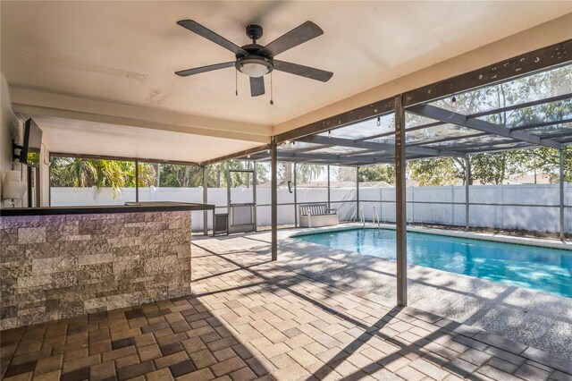 13112 Groveland St, Spring Hill, FL 34609 - view of pool featuring a fenced in pool, glass enclosure, a patio area, and a fenced backyard