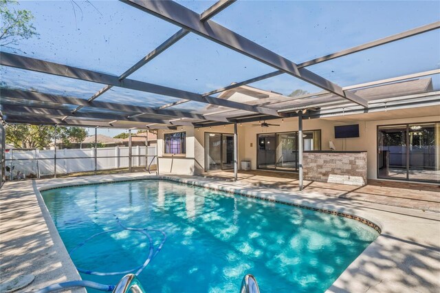13112 Groveland St, Spring Hill, FL 34609 - view of pool featuring a fenced in pool, a patio, ceiling fan, a lanai, and fence