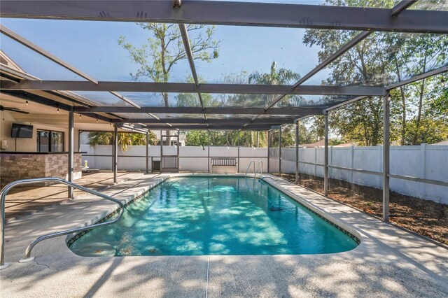 13112 Groveland St, Spring Hill, FL 34609 - view of swimming pool with a lanai, a fenced backyard, and a patio