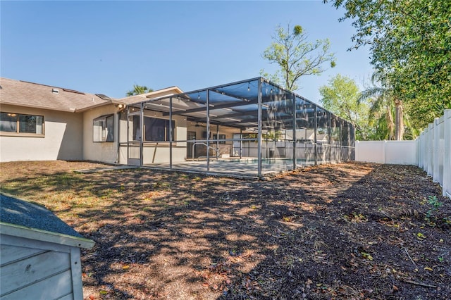 13112 Groveland St, Spring Hill, FL 34609 - exterior space with a patio, a fenced backyard, and glass enclosure