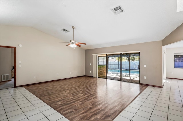 13112 Groveland St, Spring Hill, FL 34609 - unfurnished room with light wood-style floors, visible vents, and vaulted ceiling