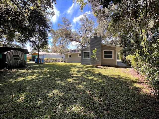 view of yard with a storage shed and an outdoor structure