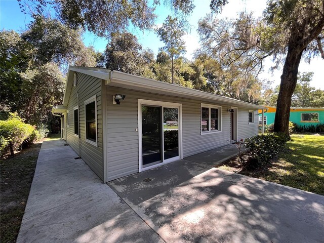 back of property featuring a patio area