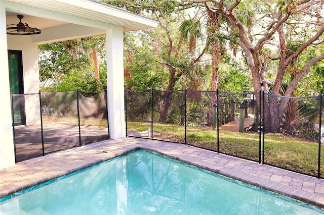 view of pool featuring a ceiling fan, a fenced in pool, fence, and a patio