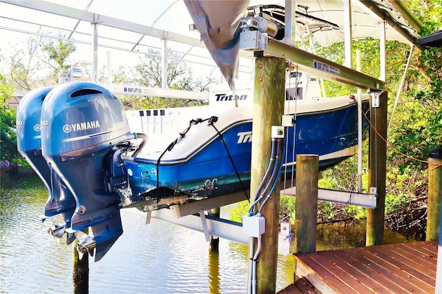 exterior space with a water view and boat lift