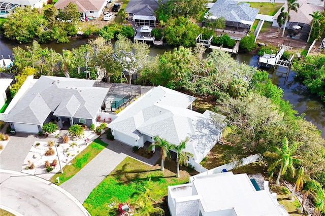 bird's eye view featuring a water view and a residential view