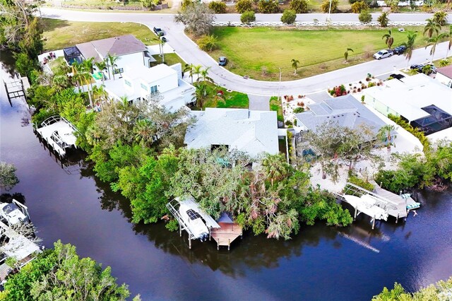 bird's eye view featuring a water view and a residential view