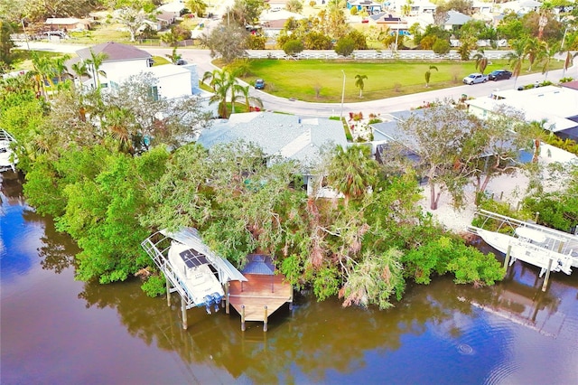 birds eye view of property with a water view and a residential view