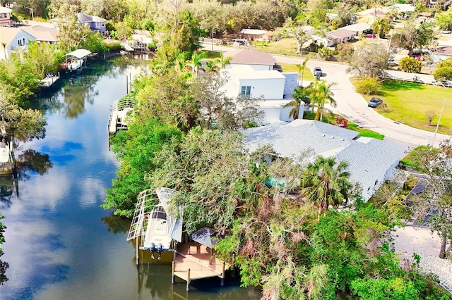 birds eye view of property featuring a water view and a residential view