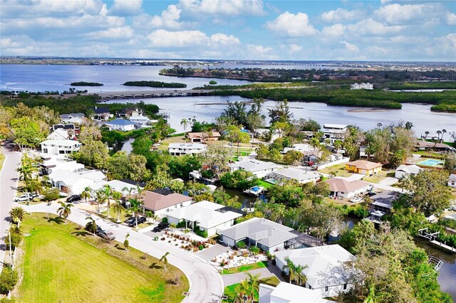 drone / aerial view featuring a residential view and a water view