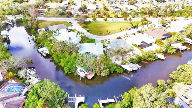 birds eye view of property featuring a residential view and a water view