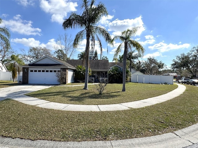 ranch-style home featuring a garage, fence, a front lawn, and concrete driveway