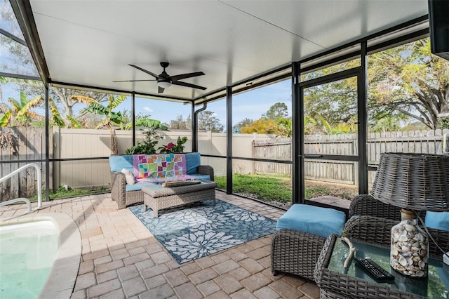 sunroom with ceiling fan