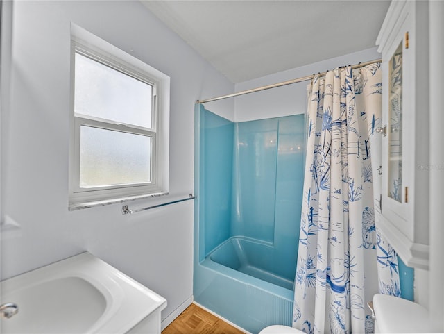 bathroom with toilet and shower / tub combo