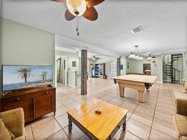 game room with visible vents, billiards, a textured ceiling, and light tile patterned floors