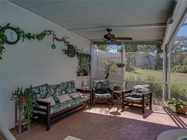 sunroom with a ceiling fan