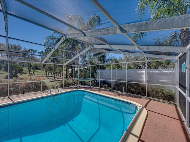 view of pool featuring a lanai, fence, and a fenced in pool