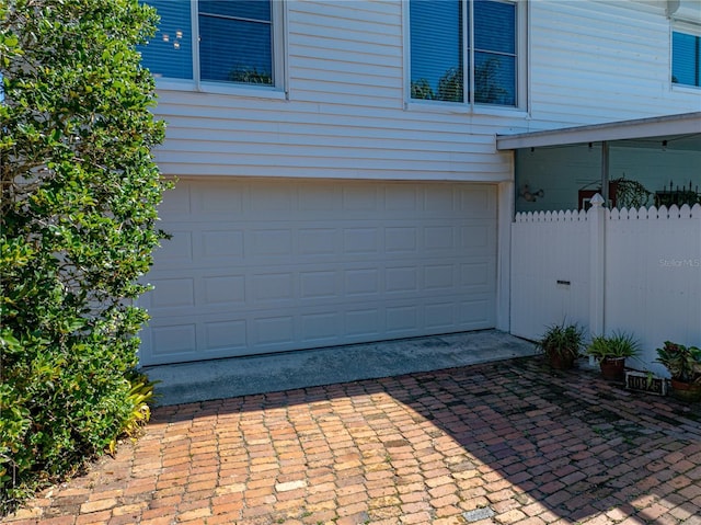 garage with fence