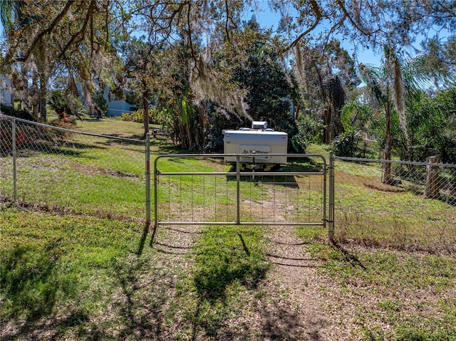 view of yard with a gate and fence