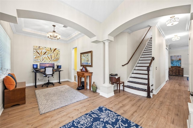 4301 W San Luis St, Tampa, FL 33629 - entrance foyer featuring light wood-type flooring, arched walkways, crown molding, and baseboards
