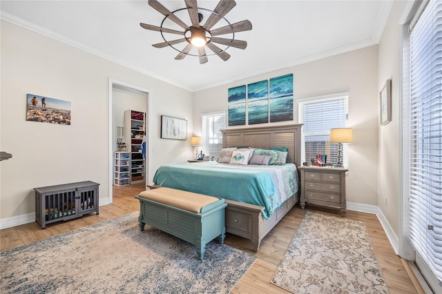 4301 W San Luis St, Tampa, FL 33629 - bedroom featuring baseboards, crown molding, a spacious closet, and light wood finished floors