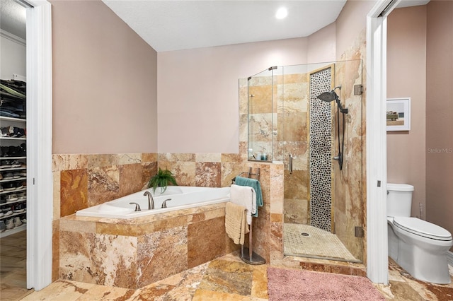 4301 W San Luis St, Tampa, FL 33629 - full bathroom with a stall shower, a walk in closet, toilet, and a bath