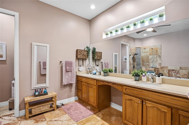 4301 W San Luis St, Tampa, FL 33629 - full bathroom with double vanity, recessed lighting, a stall shower, a sink, and baseboards