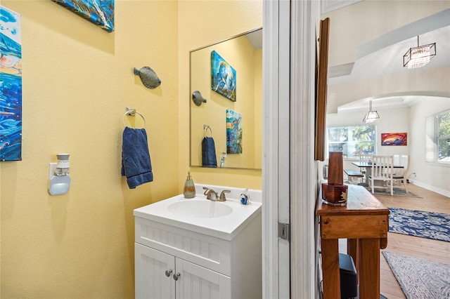 4301 W San Luis St, Tampa, FL 33629 - bathroom with vanity, baseboards, and wood finished floors