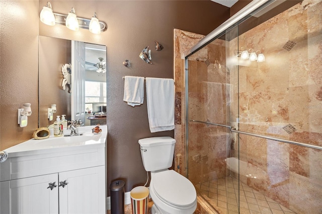 4301 W San Luis St, Tampa, FL 33629 - bathroom with ceiling fan, vanity, a shower stall, and toilet