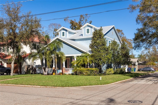 4301 W San Luis St, Tampa, FL 33629 - view of front facade featuring covered porch and a front yard
