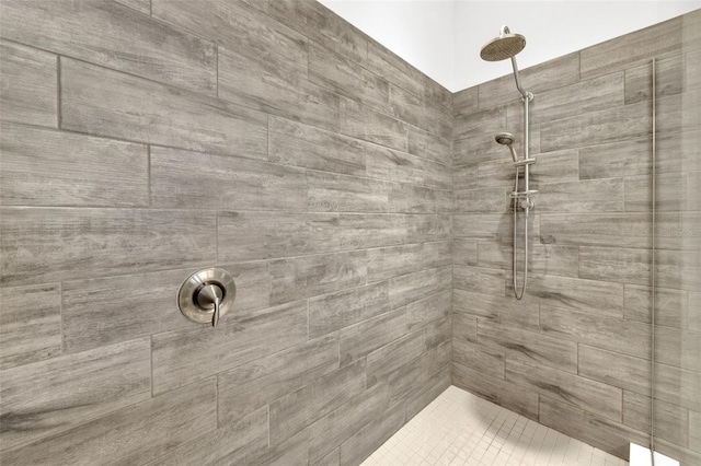 bathroom with a tile shower